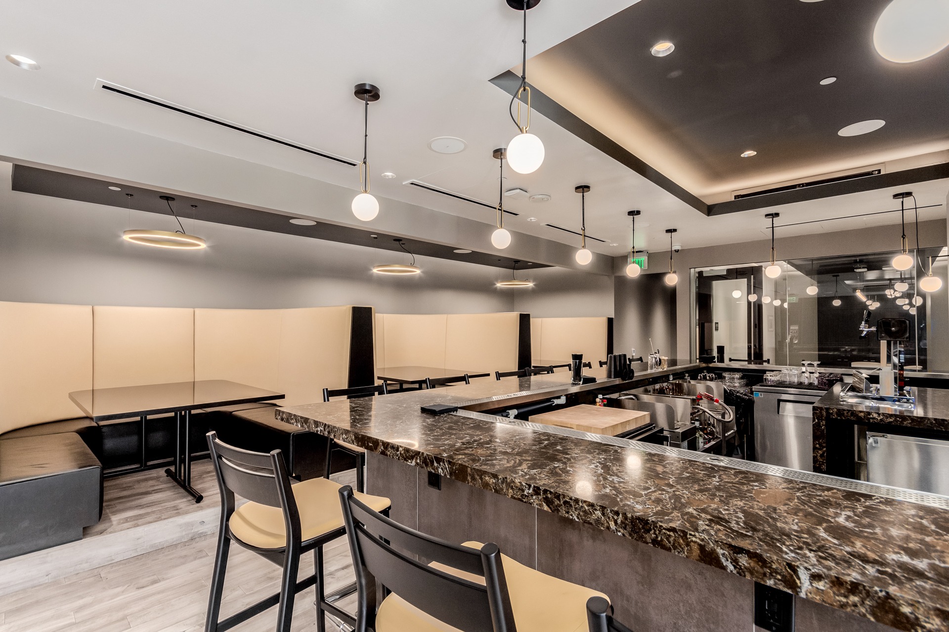 Private Legacy Club bar with counter seating and dining booths